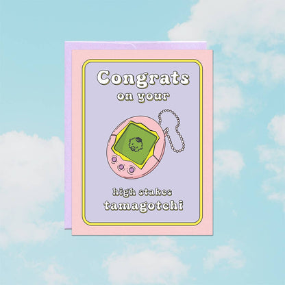 Illustrated pink Tamagotchi toy on a lavender and pink retro border, reading Congrats on your high stakes tamagotchi