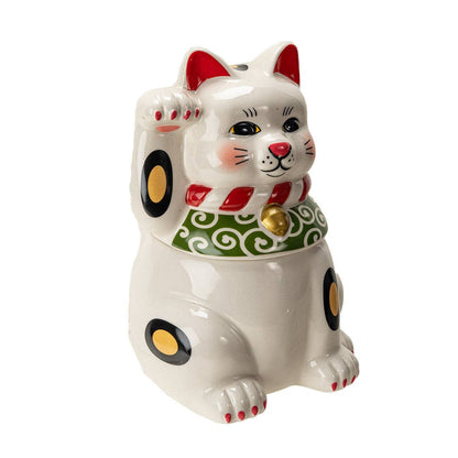 Close-up of the lucky cat cookie jar's painted face detail