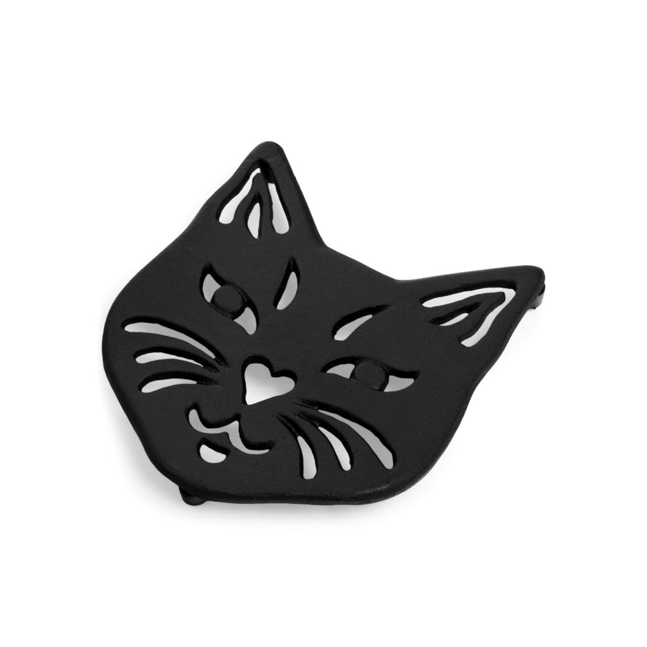 Black cast iron trivet shaped like a cat face with cutout whisker details - PABOOM