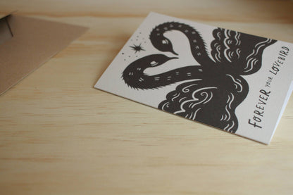 'Lovebirds' romantic card shown at an angle with envelope