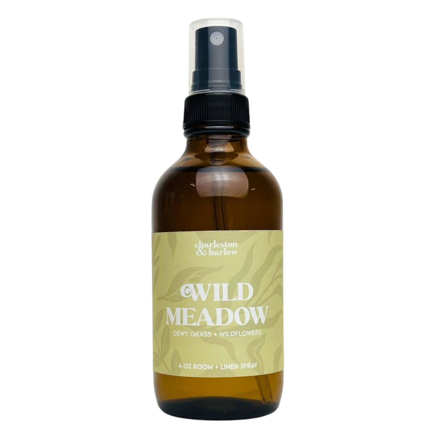 Amber glass spray bottle of Charleston & Harlow Wild Meadow room and linen spray with sage green leaf-patterned label