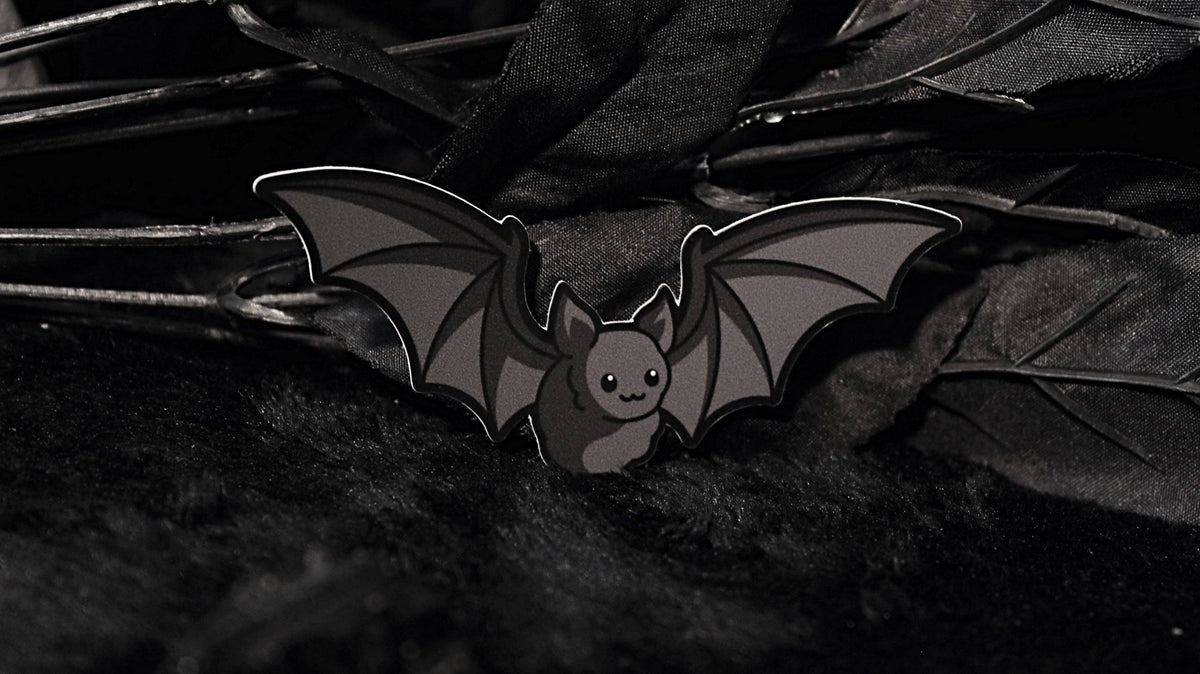 Bat Sticker shown next to a coin for size reference