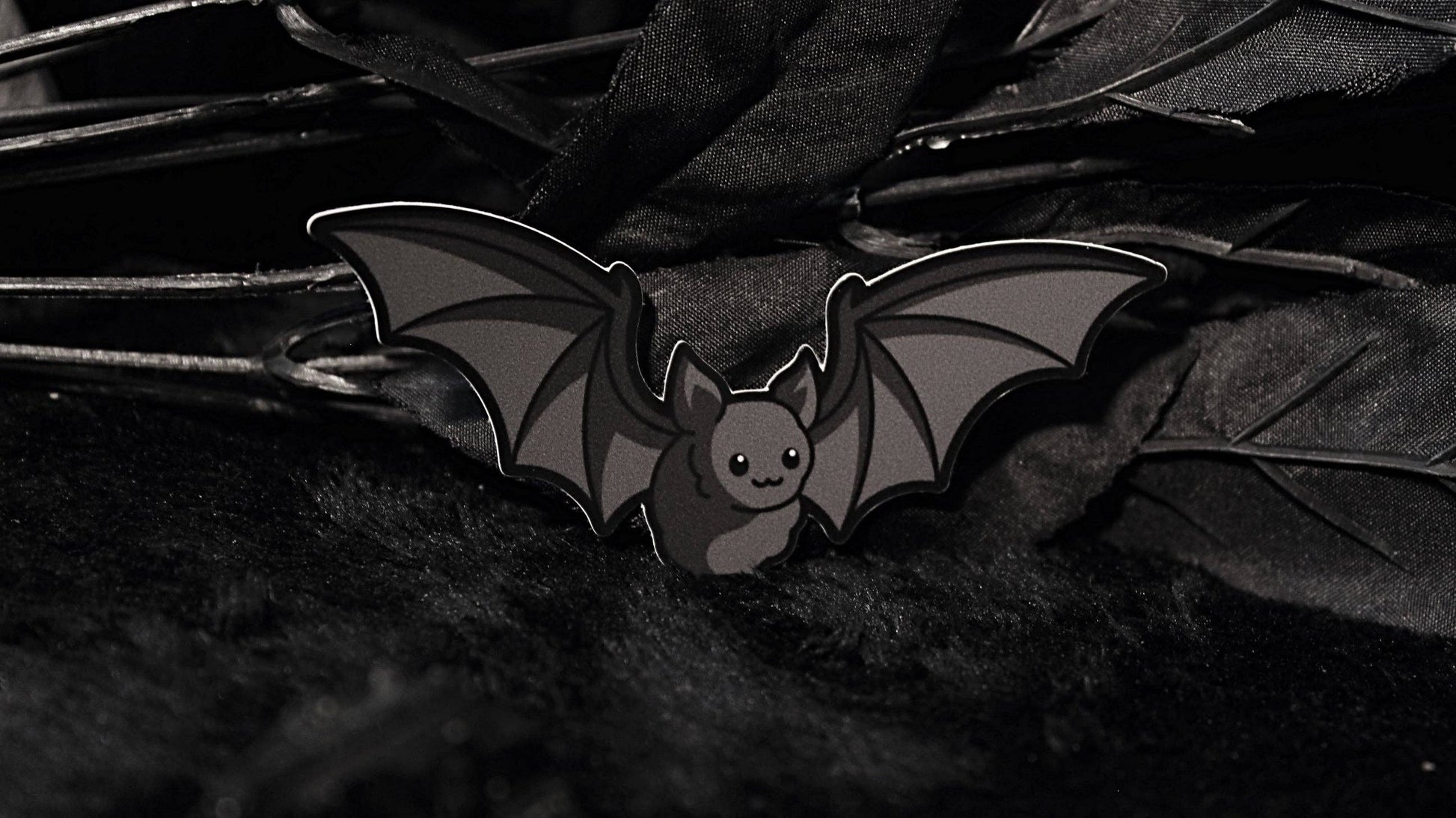 Bat Sticker shown next to a coin for size reference
