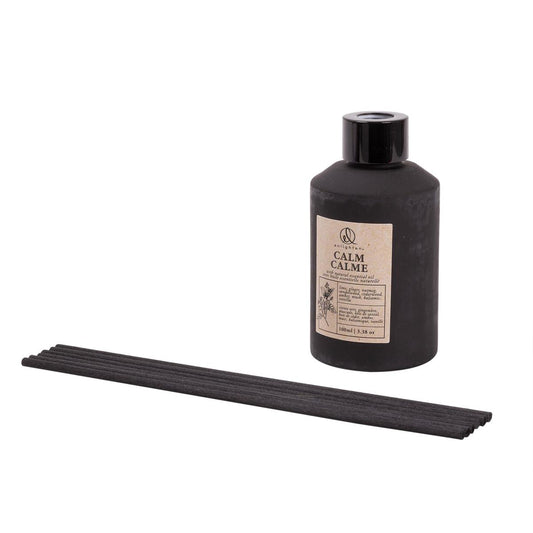 Enlighten Calm reed diffuser in a black glass bottle with black reed sticks - PABOOM