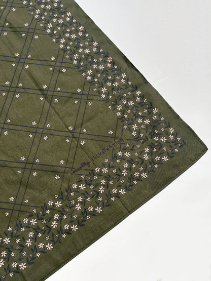The Scrolling Floral bandana styled as an accessory