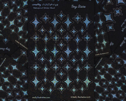 A 4x6 inch sticker sheet covered in tiny glittery rainbow star stickers against a dark background