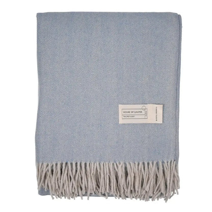 Cornflower herringbone wool throw folded to show fringe detail - PABOOM