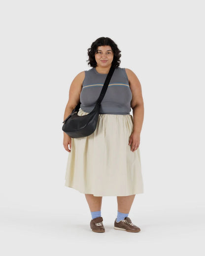 Interior view of the BAGGU Medium Recycled Leather Flat Crescent bag showing the zip pocket
