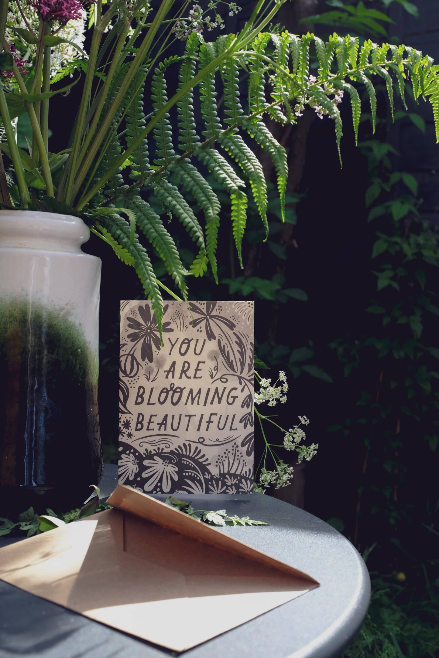 Close-up of the floral linework border on 'You Are Blooming Beautiful' card