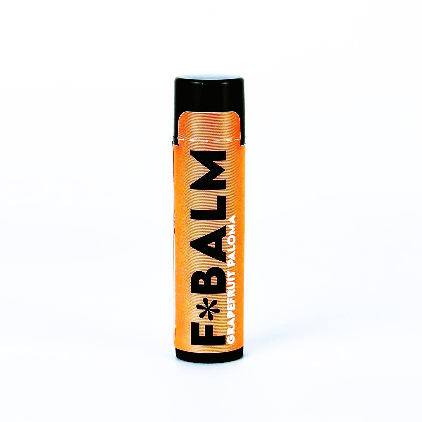 Charleston & Harlow F*Balm Grapefruit Paloma lip balm tube with orange kraft-paper label