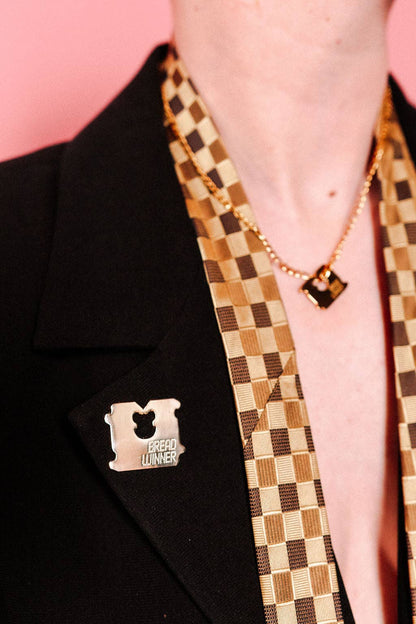 Bread Winner pin shown at a close angle