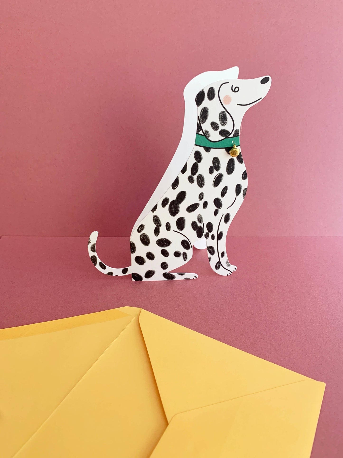 Sitting Dalmatian Shaped Greeting Card shown with its yellow envelope