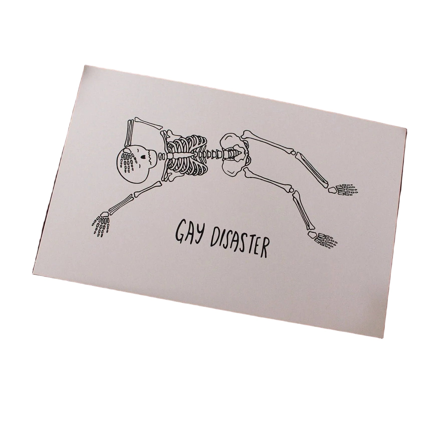 Hand-drawn illustrated print of two skeletons kissing head to head with the hand-lettered words Gay Disaster below, on cream cardstock