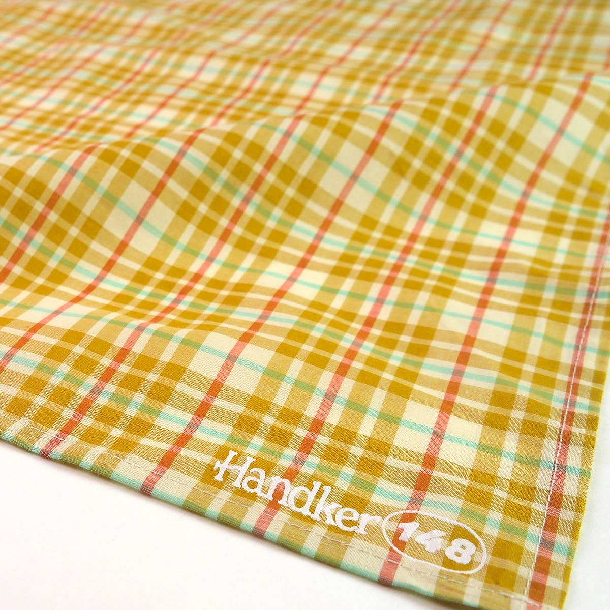 Close-up detail of the Marmee Bandana's reversible woven cotton print