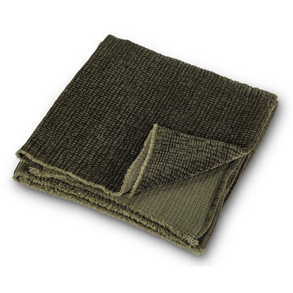 Dark green ribbed chenille throw blanket, 50 by 60 inches, draped over furniture
