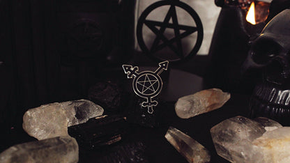Close-up of the Trans Symbol Pentacle enamel pin showing the gold-plated detailing