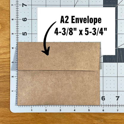 A Little Birdie Told Me card paired with its kraft envelope