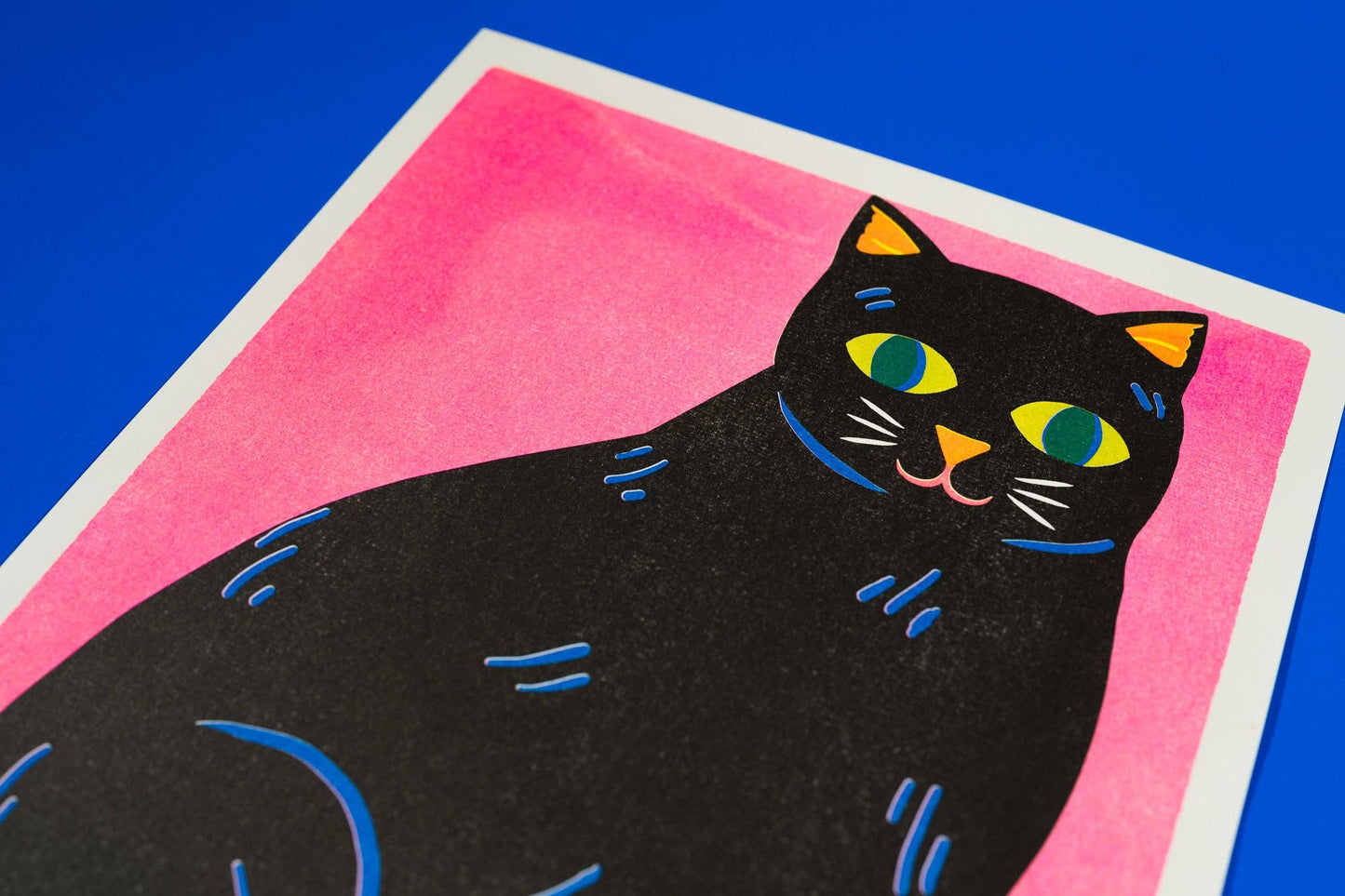 Black Cat risograph print corner showing paper texture - PABOOM