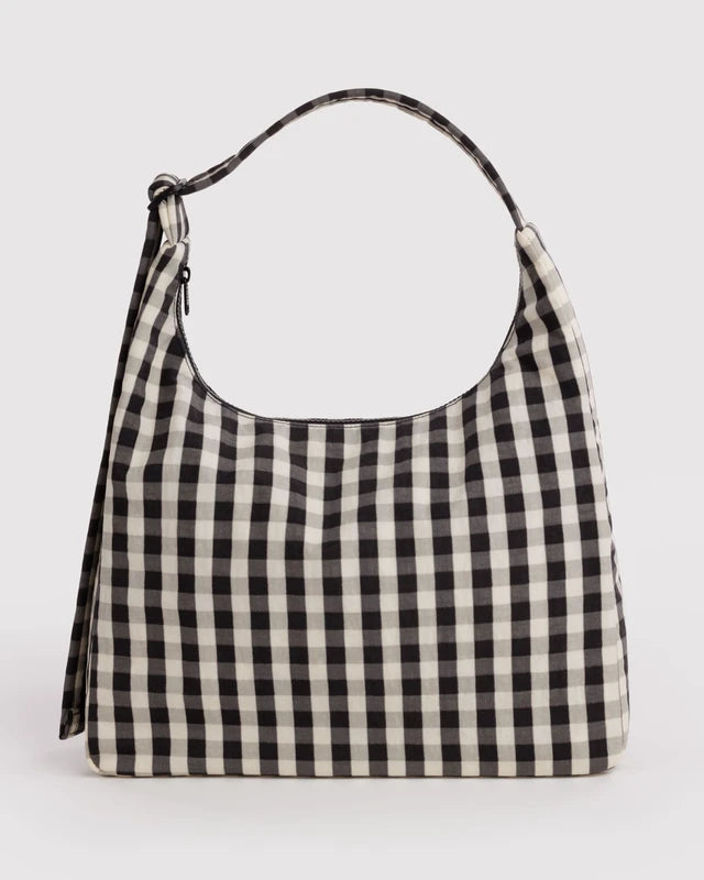 BAGGU Nylon Shoulder Bag in black and cream gingham check, shown from the front with its curved top handle