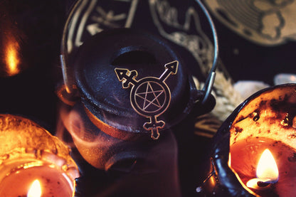 Trans Symbol Pentacle pin shown with its black rubber pin backs