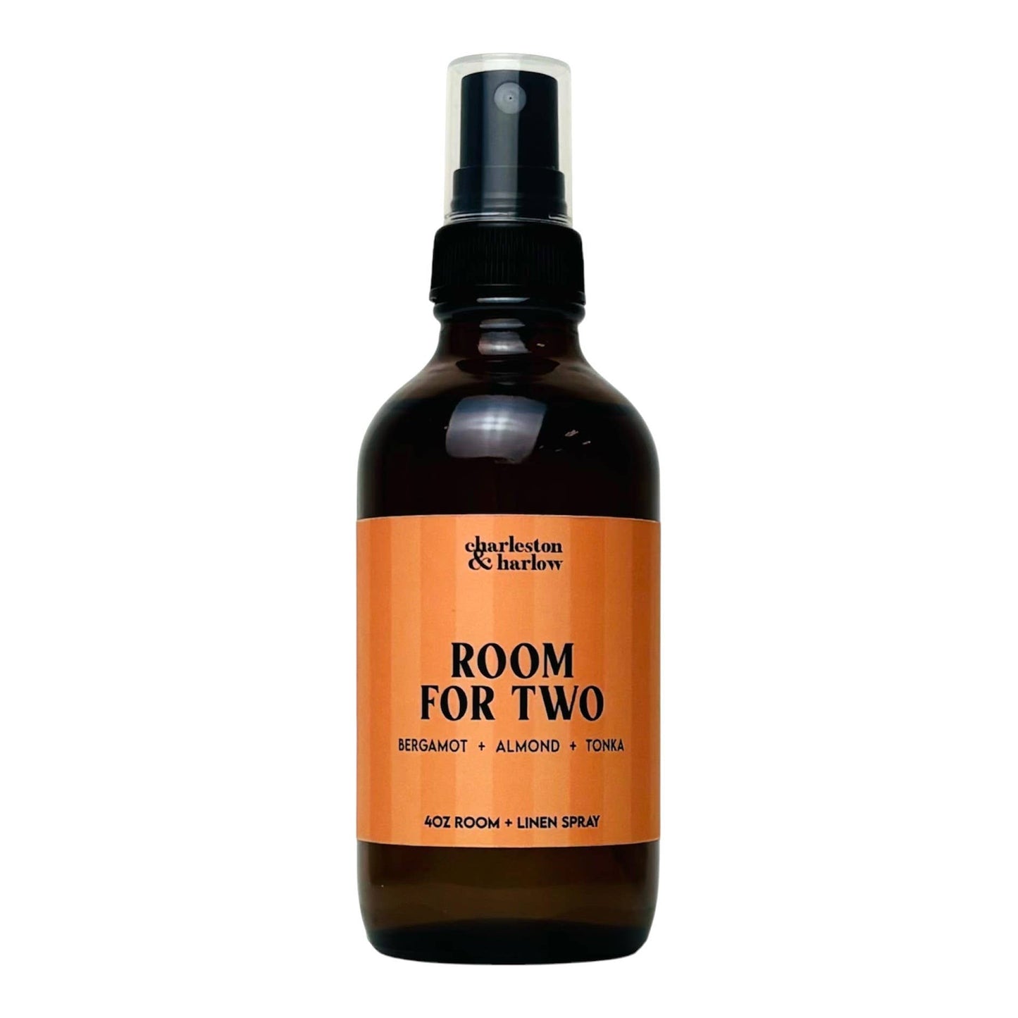 Amber glass spray bottle of Charleston & Harlow Room For Two room and linen spray with peach striped label