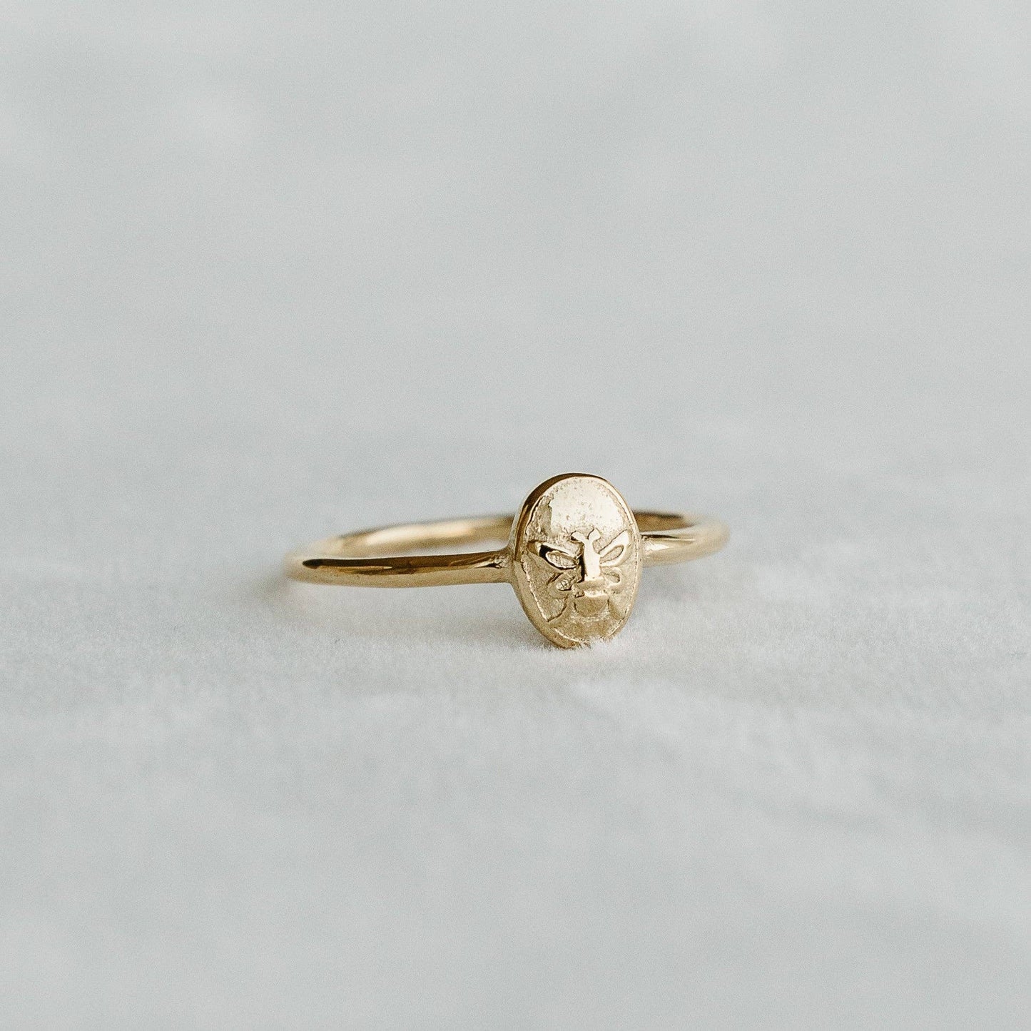 Bee Signet Ring with an embossed bee motif on an oval gold face - PABOOM