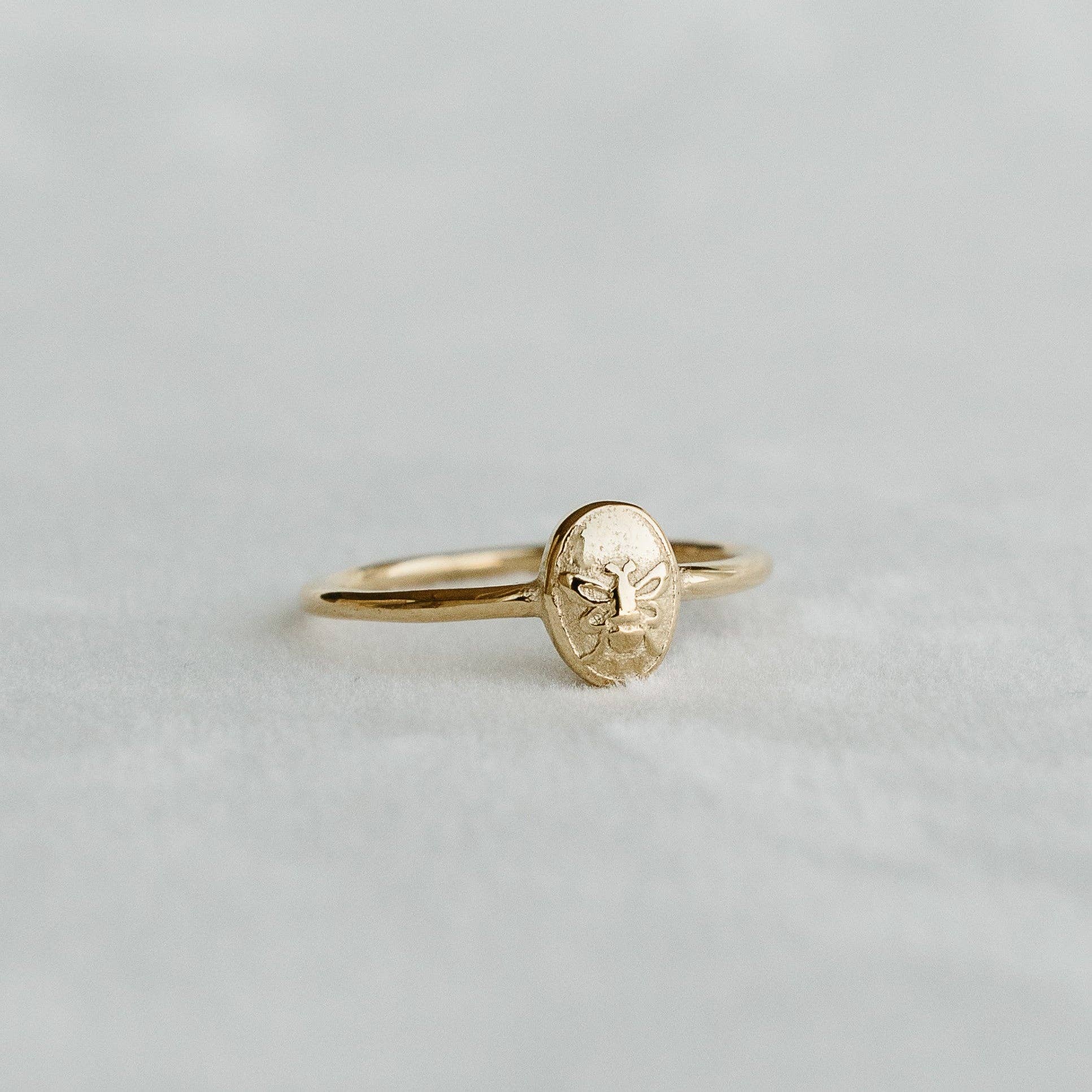 Bee Signet Ring with an embossed bee motif on an oval gold face - PABOOM