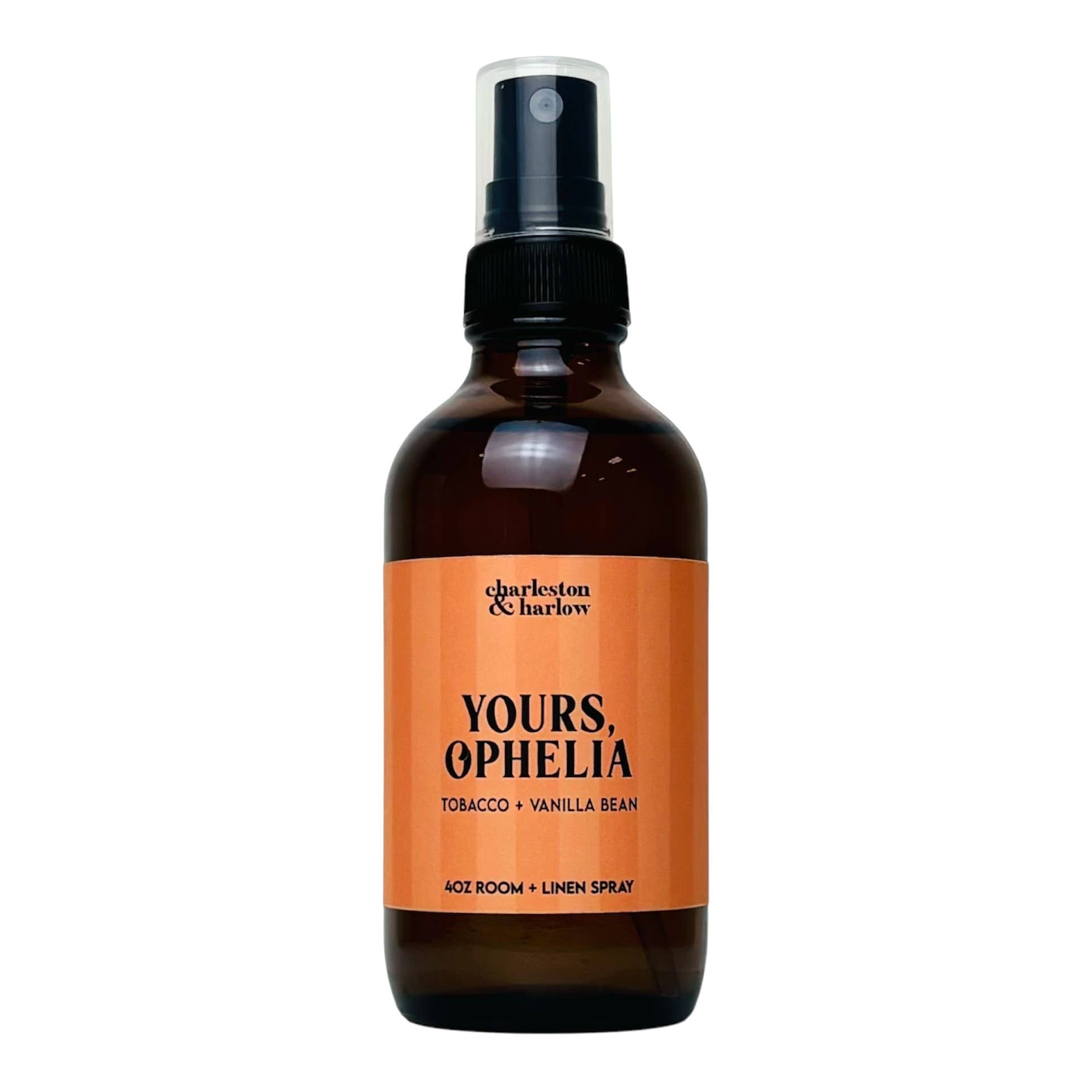 Amber glass spray bottle of Charleston & Harlow Yours, Ophelia room and linen spray with peach striped label