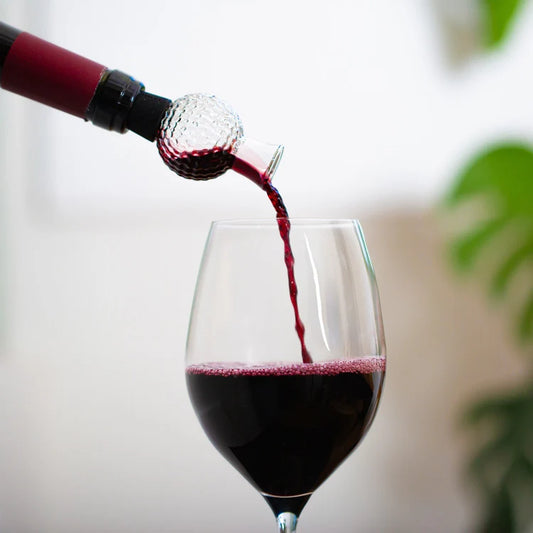 Golf wine aerator shown from the side on white background.