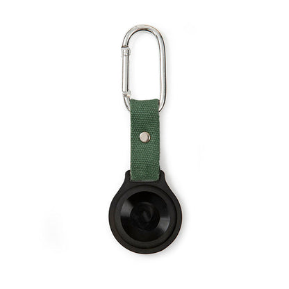 Black silicone AirTag holder with olive green canvas strap and silver carabiner clip, hanging vertically.