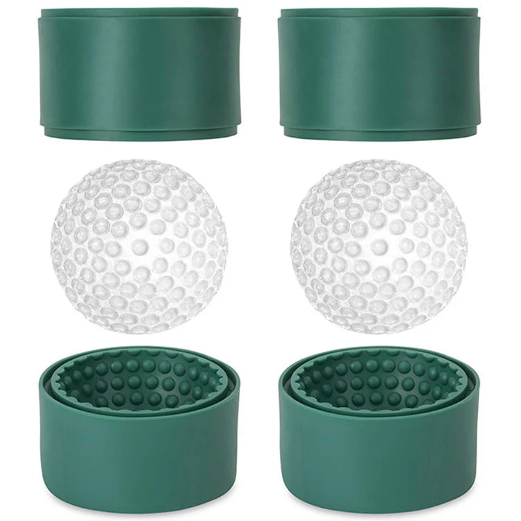 Green silicone golf ball ice molds with two clear dimpled ice balls resting on the open mold halves.