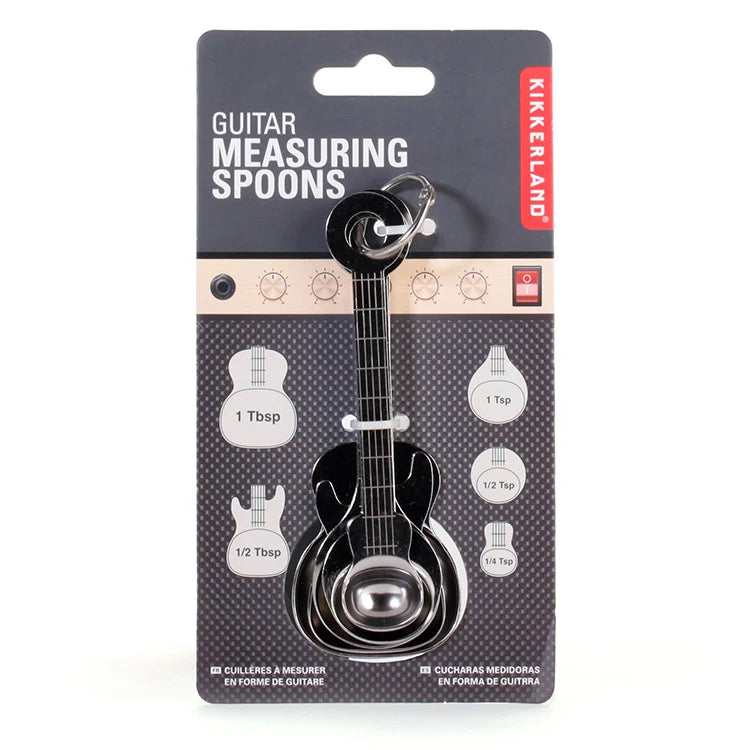 Close-up of guitar measuring spoon detail including string-like markings.