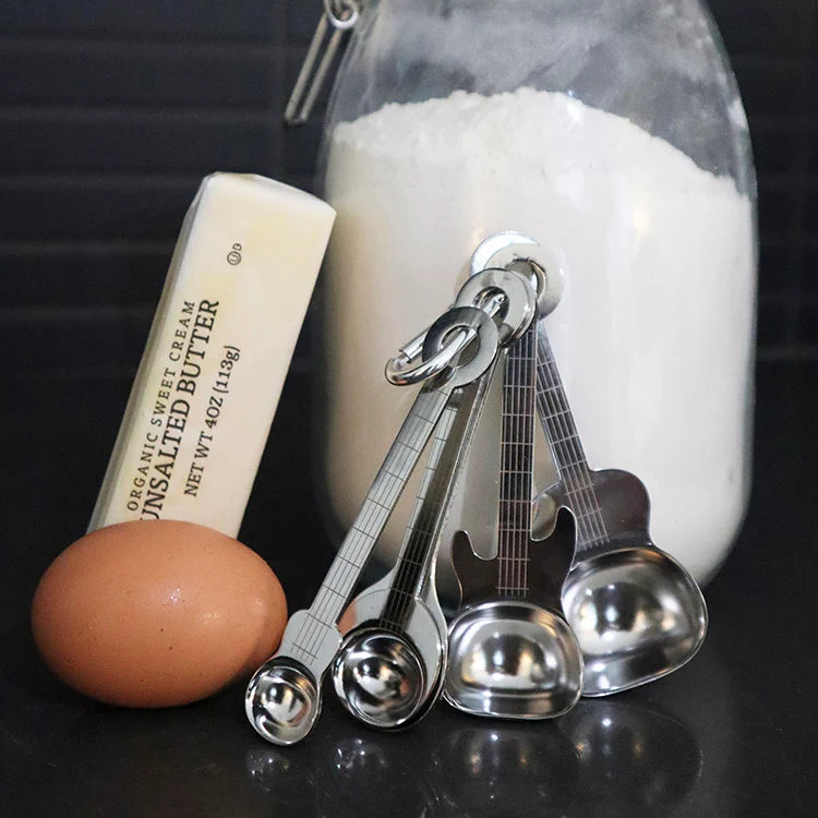 Guitar-shaped measuring spoon set shown from above.