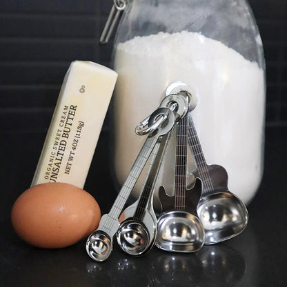 Guitar-shaped measuring spoon set shown from above.