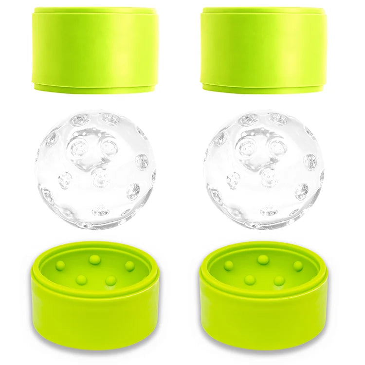 Green silicone pickleball-shaped ice ball molds with two clear textured ice balls resting between the mold halves.