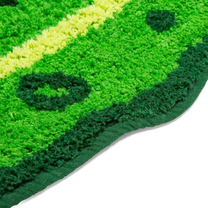 Pickle bath mat shown on a bathroom floor.