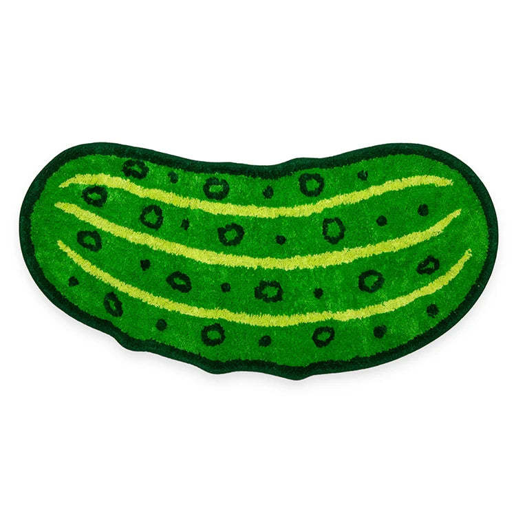 Green pickle-shaped bath mat with tufted texture and dark green outline, shown flat on a white background.