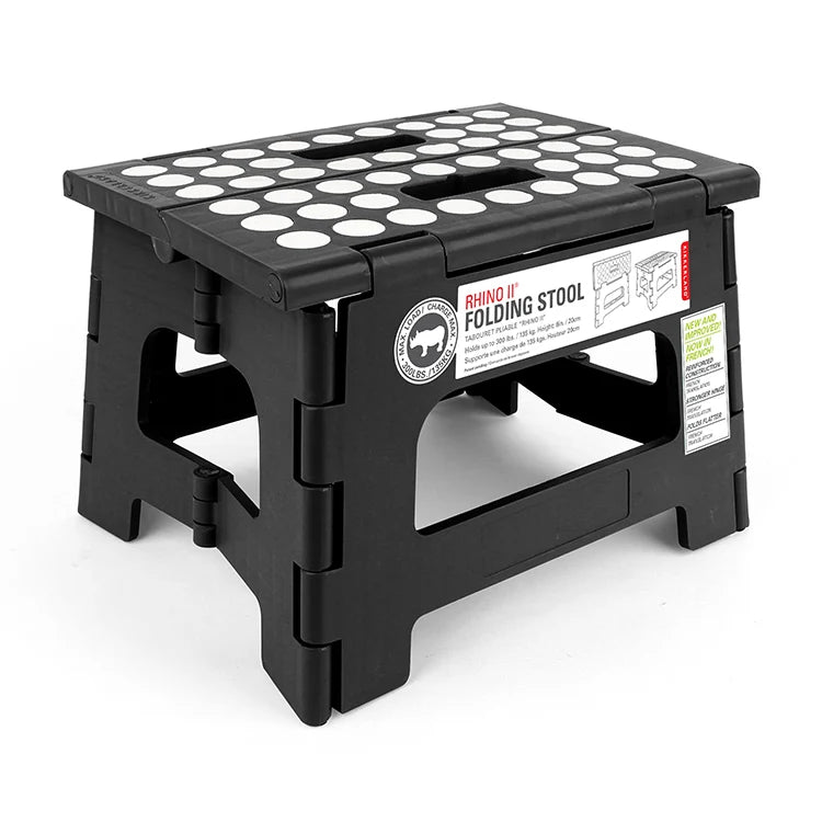 Black Rhino II folding step stool with white non-slip dot pattern on top, shown open at an angle with product label visible.