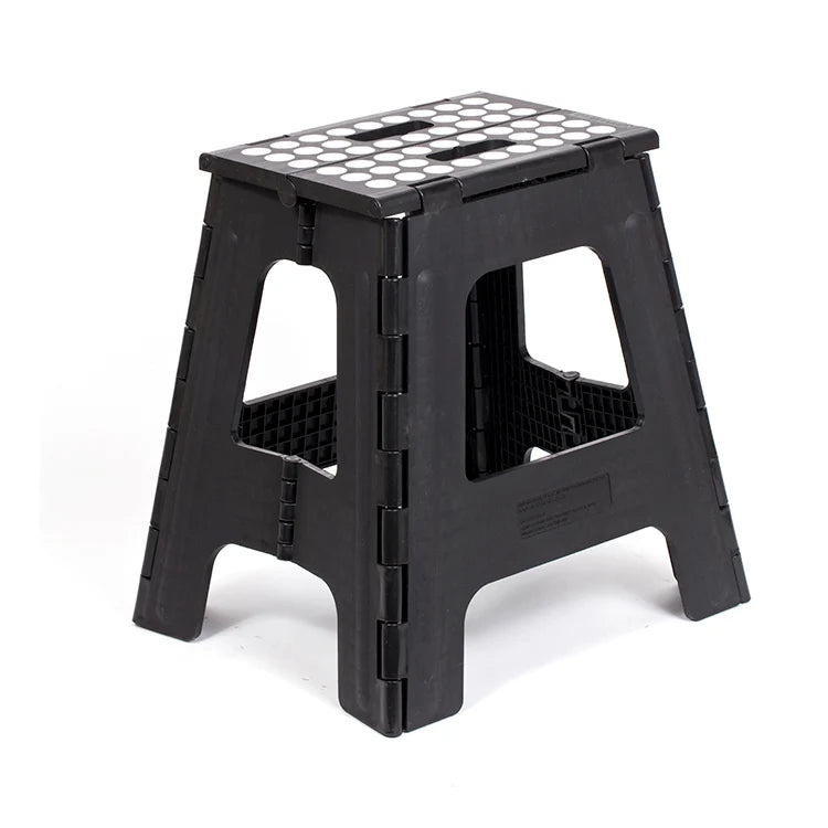 Black tall folding step stool with non-slip white dot tread pattern, shown open in a three-quarter view.