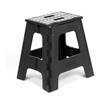 Black tall folding step stool with non-slip white dot tread pattern, shown open in a three-quarter view.