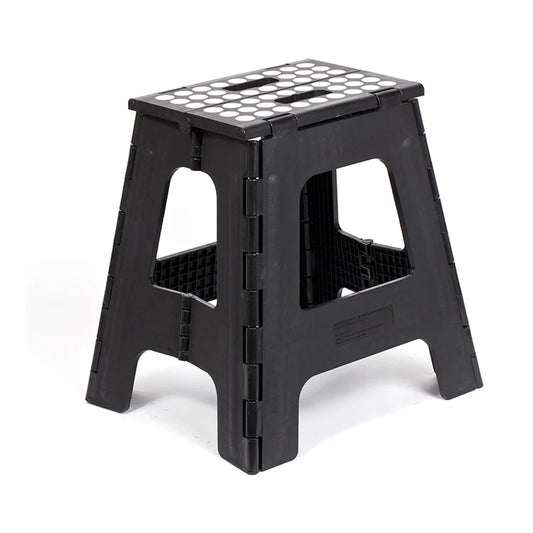 Black tall folding step stool with non-slip white dot tread pattern, shown open in a three-quarter view.