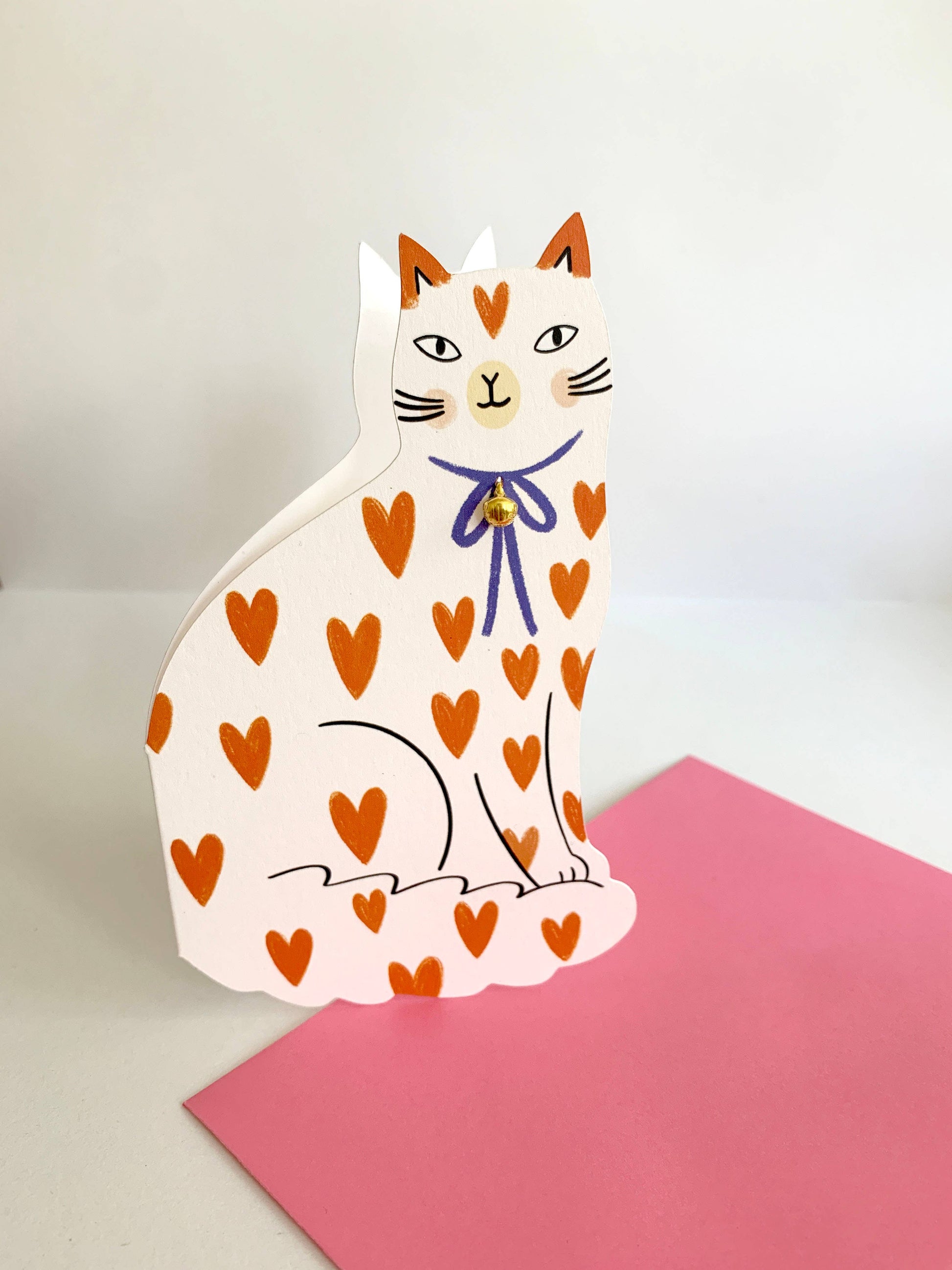 Sitting Kitty Shaped Greeting Card Loveheart shown at an angle highlighting the heart-print pattern