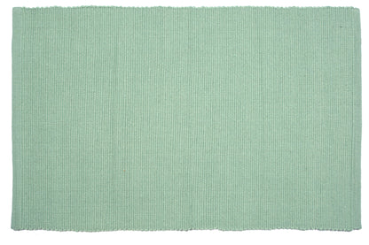 Solid light green rectangular rug on a white background