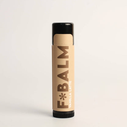 Charleston & Harlow F*Balm Vanilla Latte lip balm tube with tan kraft-paper label