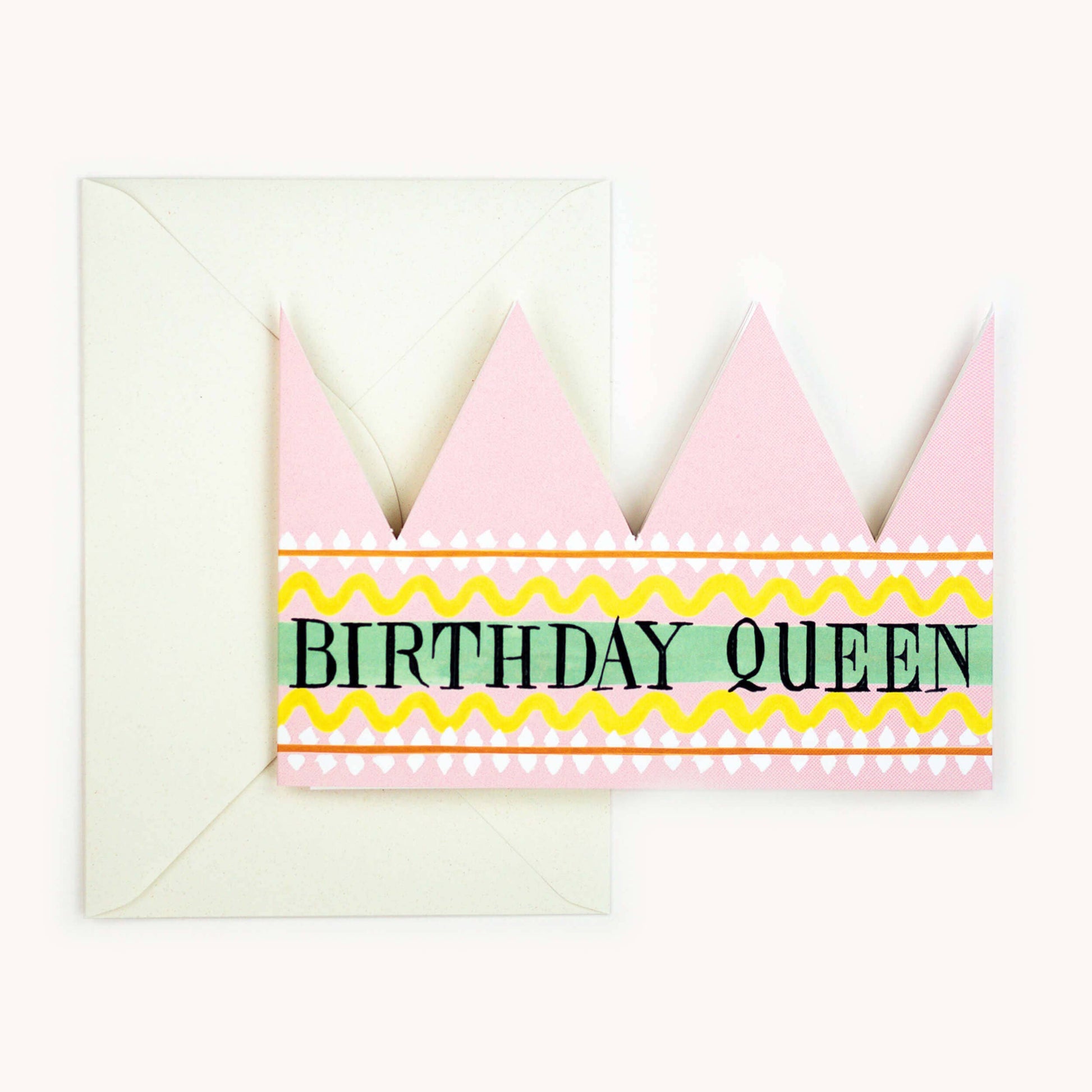 Pink party hat crown card with a mint green and yellow striped band reading 'BIRTHDAY QUEEN' in black, cream envelope behind