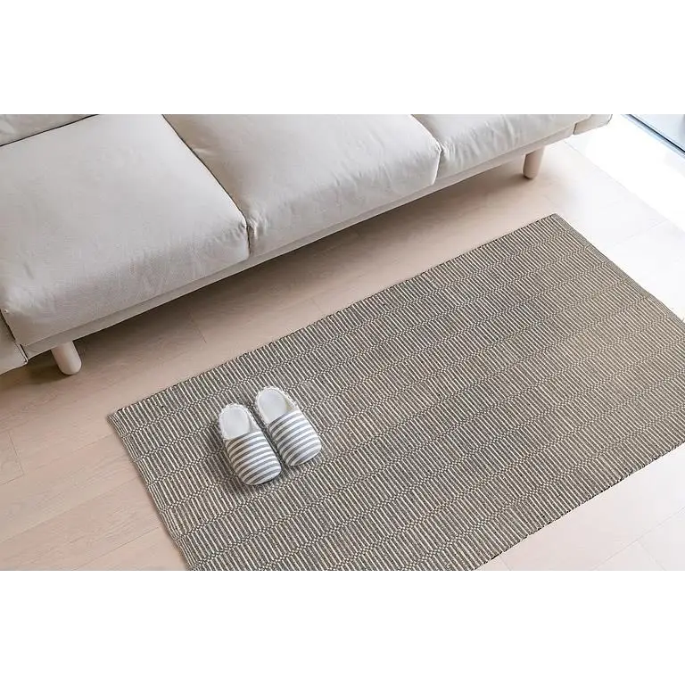 Multicolour broken stripe cotton mat styled in living room with couch and slippers – 36x60 inch - PABOOM