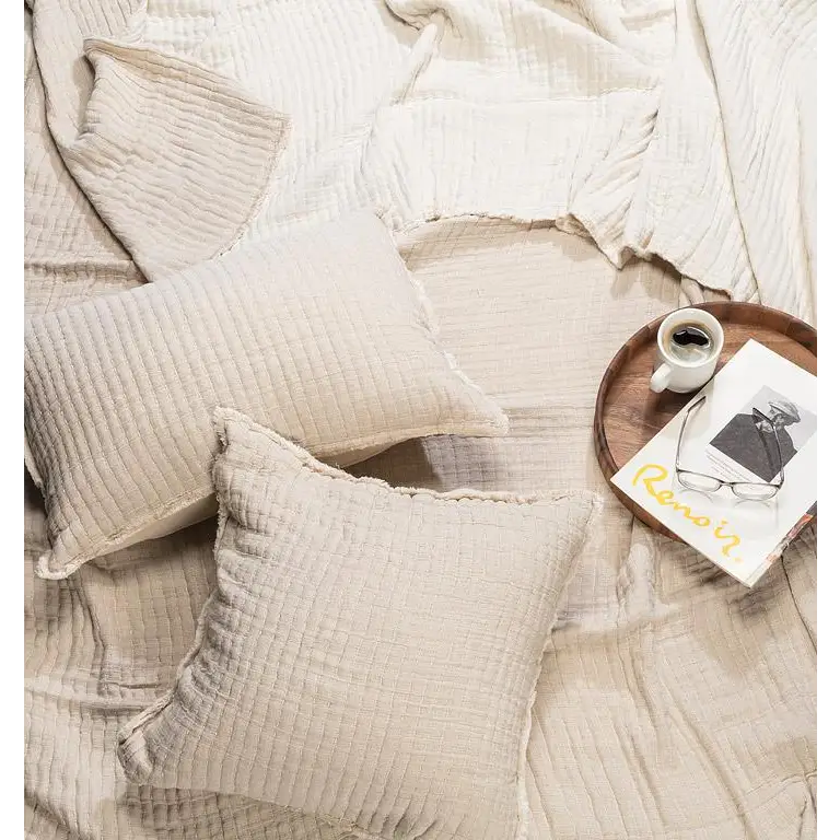 "Kantha bed cover in beige styled with pillows and coffee tray on bed, cotton texture 90x90 - PABOOM"