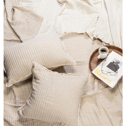 "Kantha bed cover in beige styled with pillows and coffee tray on bed, cotton texture 90x90 - PABOOM"