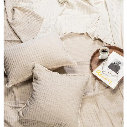 "Kantha bed cover in beige styled with pillows and coffee tray on bed, cotton texture 90x90 - PABOOM"