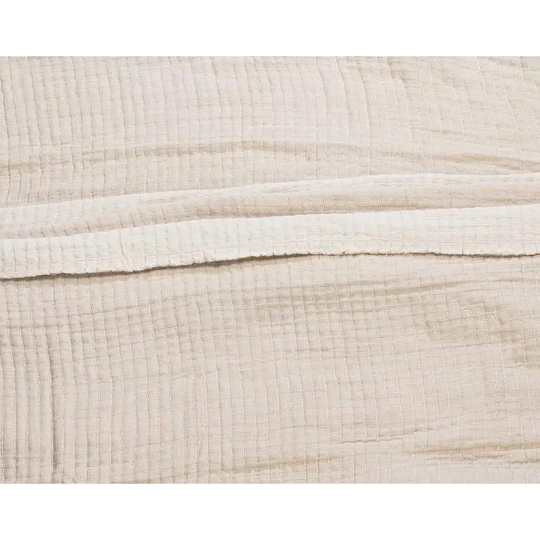 Close-up of textured beige Kantha cotton bed cover fabric layers and stitching - PABOOM
